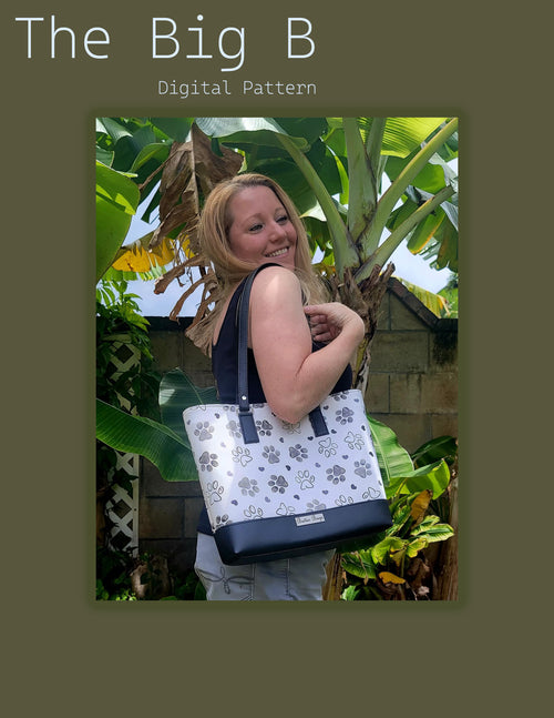 Woman holding a tote bag with floral design in front of a banana plant